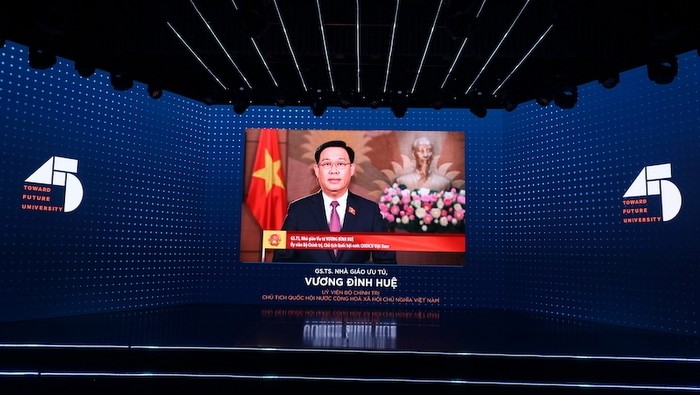NA Chairman Vuong Dinh Hue delivered a congratulatory speech in the form of video recording to the UEH. (Photo: ueh.edu.vn)