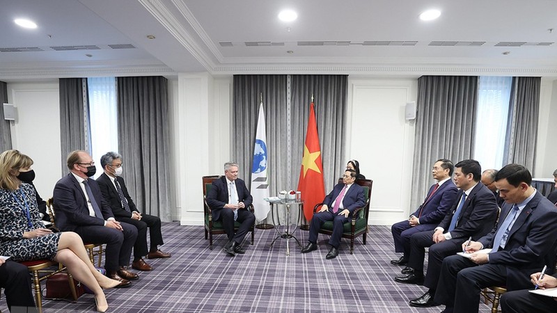 The meeting between Prime Minister Pham Minh Chinh and OECD Secretary General Mathias Cormann (Photo: VNA)