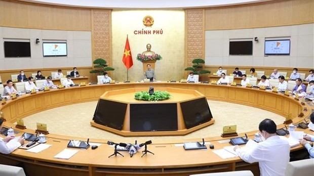 Prime Minister Pham Minh Chinh on November 6 presides over a Cabinet meeting to review socio-economic performance in the first ten months of 2021. (Photo: VNA)