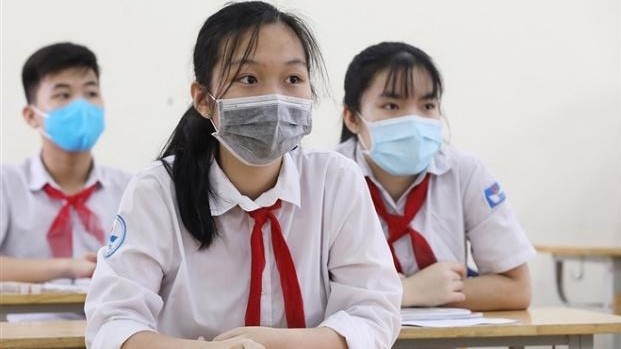Students wear masks in class to prevent the spread of COVID-19.