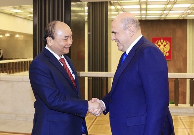 President Nguyen Xuan Phuc (L) and Russian Prime Minister Mikhail Mishustin during their meeting in Moscow on December 1 as part of the former's official visit to Russia. (Photo: VNA)