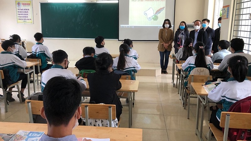 Students in grade 9 at Tan Hoi Secondary School in Dan Phuong district, Hanoi attend in-person class.
