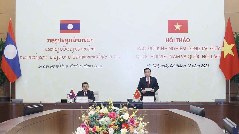 The seminar to share experience in parliamentary activities between Vietnam and Laos. (Photo: VNA)