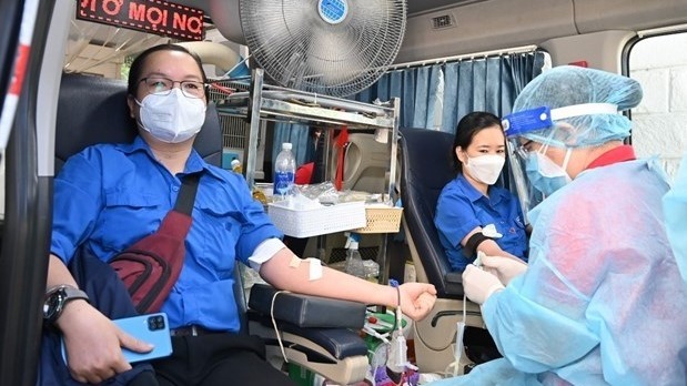 A blood donation event takes place during the 10th International Festival of Volunteers in Ho Chi Minh City on December 5. (Photo: VNA)