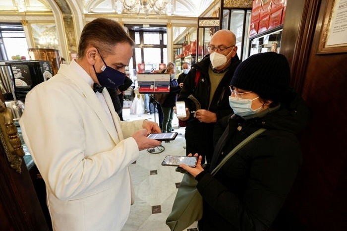 Italy tightened curbs on Monday on people still not vaccinated against COVID-19, while Poland's prime minister warned of new restrictions this week.