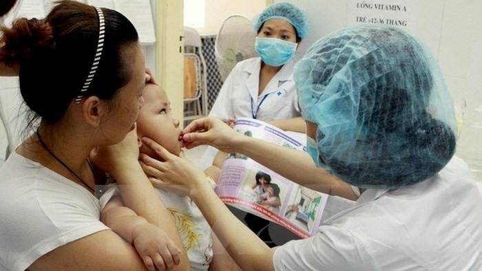 Vietnamese children receive free vitamin A supplements twice annually. (Photo: VNA)