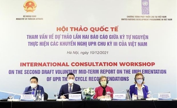 Deputy FM Dang Hoang Giang and other delegates at the international consultation workshop on the second draft voluntary mid-term report on the implementation of UPR third cycle recommendations (Photo: VNA)