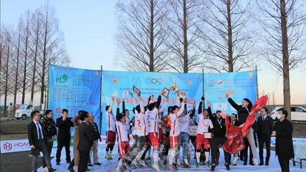FC Real Robama members celebrate after winning the tournament. (Photo: VNA)
