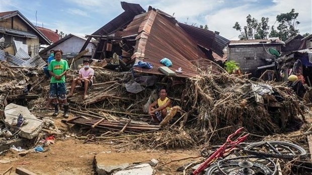 Houses in Bais city of the Philippines are destroyed by Typhoon Rai. (Photo: AFP/VNA)