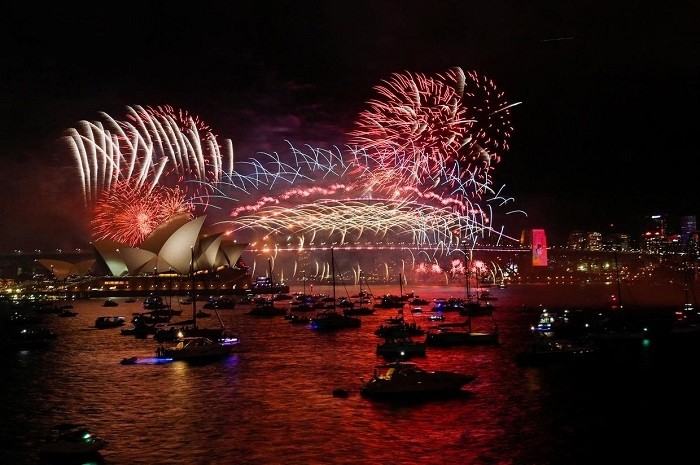 Fireworks explode over Sydney Harbour during New Year's Eve celebrations in Sydney, Australia, January 1, 2022. (Photo: Reuters)
