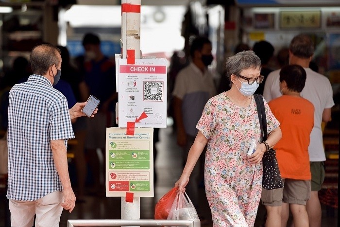 Singapore expects the Omicron coronavirus variant to cause a bigger wave of infections than Delta, the health ministry said on Wednesday, adding a booster dose will soon be required for adults to be considered fully vaccinated.