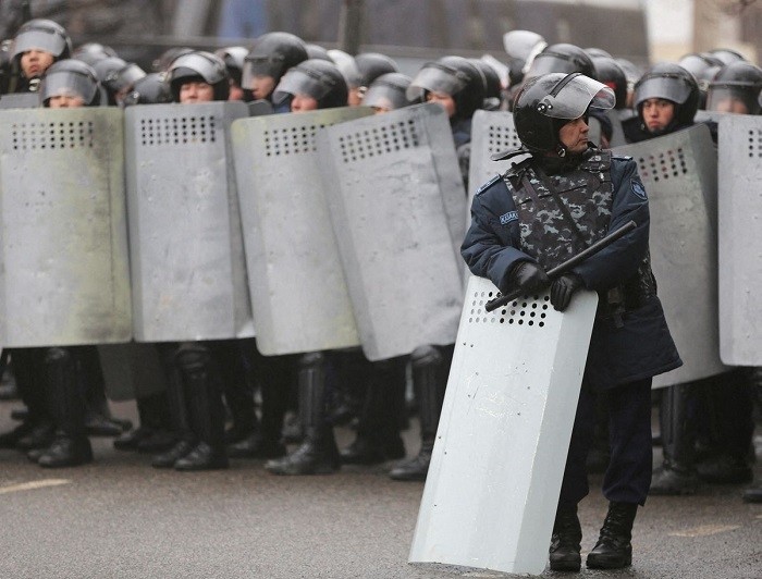 Kazakh law enforcement officers block a street during a protest triggered by fuel price increase in Almaty, Kazakhstan January 5, 2022. (Photo: Reuters)