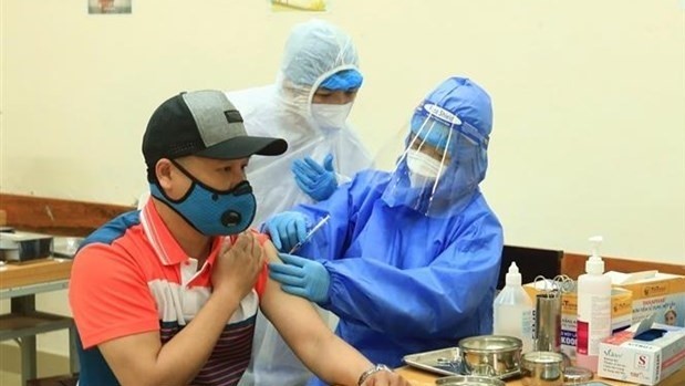 People get vaccinated against COVID-19. Illustrative image (Photo: VNA)