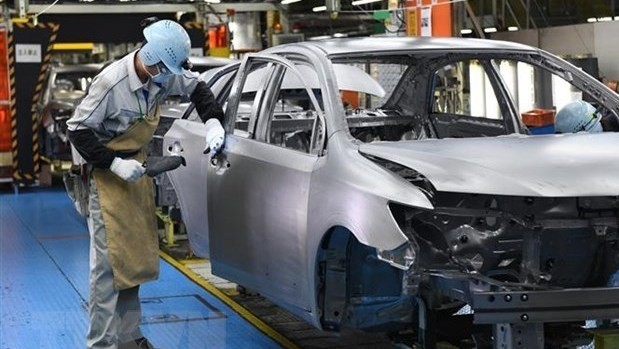 A worker at an automobile factory in Aichi, Japan (Photo: AFP/VNA)