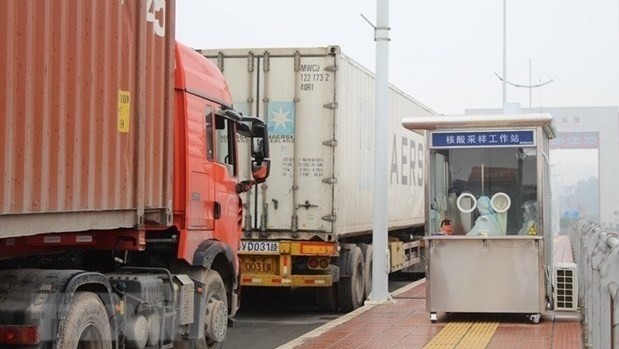 Trucks under customs clearance process at the Mong Cai border gate (Photo: VNA)