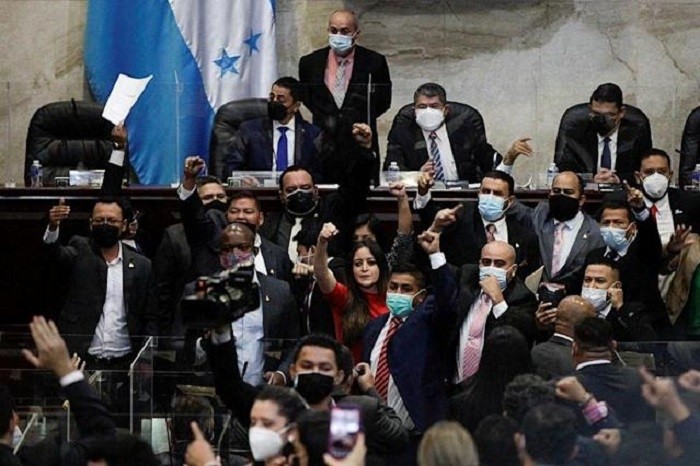 Honduran lawmakers brawl during Congress installation, in Tegucigalpa.