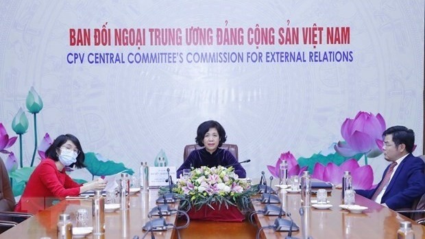 Deputy head of the Party Central Committee's Commission for External Relations Nguyen Thi Hoang Van (middle) at the event