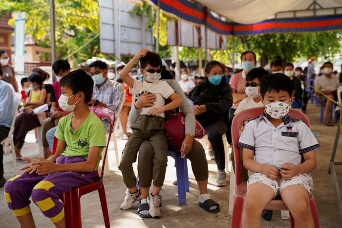 Children and their parents wait to receive a vaccine against the coronavirus disease (COVID-19) at a health center as Cambodia begins to vaccinate children aged 3 to 5 years old, in Phnom Penh, Cambodia, February 23, 2022. (Photo: Reuters)