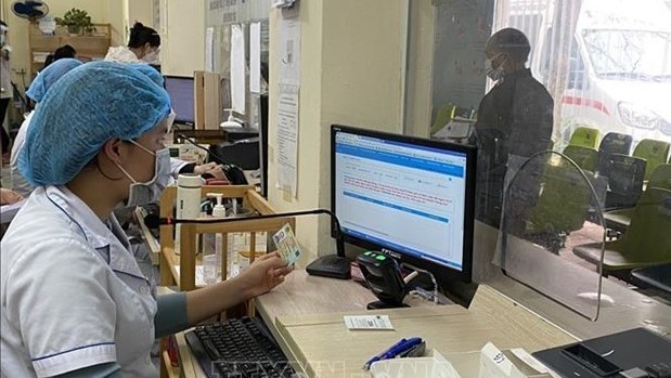 So far, health insurance information of 33 million VSS customers have been integrated into their ID cards. (Photo: VNA)