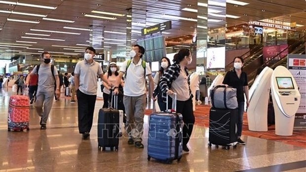Passengers at Changi International Airport of Singapore (Photo: VNA)