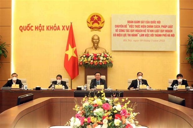 NA Chairman Vuong Dinh Hue attends the working session. (Photo: VNA)