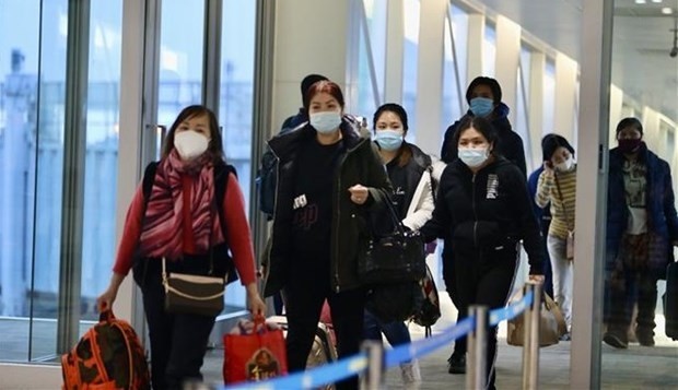 Vietnamese people in Ukraine arrive at Noi Bai international airport. (Photo: VNA)