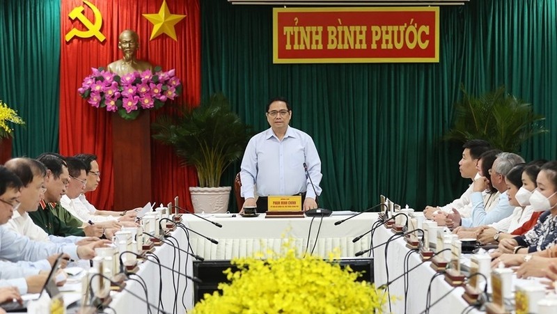 The working session between Prime Minister Pham Minh Chinh and Binh Phuoc leaders (Photo: VNA)