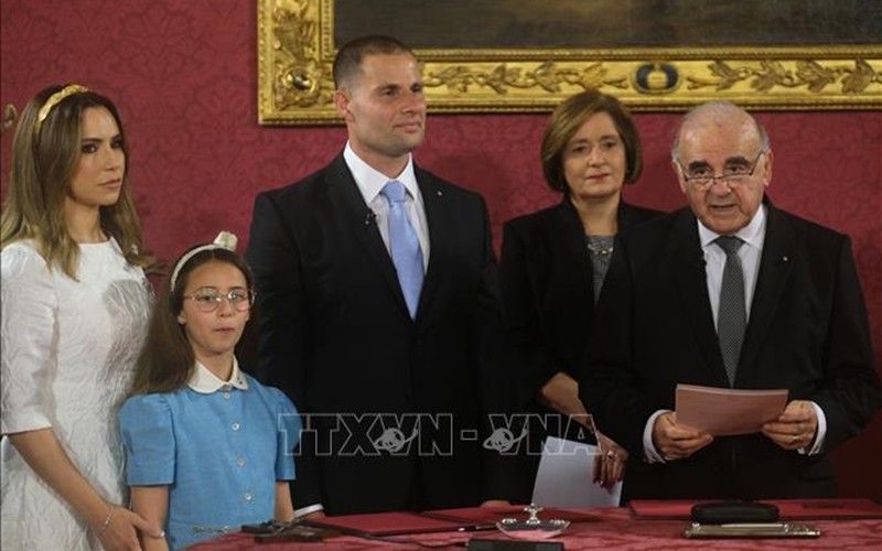 Robert Abela (middle) is sworn in as the new Prime Minister before President George Vella (right) following his victory in legislative elections.