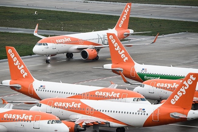 A renewed surge of COVID-19 in Britain has forced airlines including easyJet to cancel hundreds of flights in recent days as staff sickness levels soar.