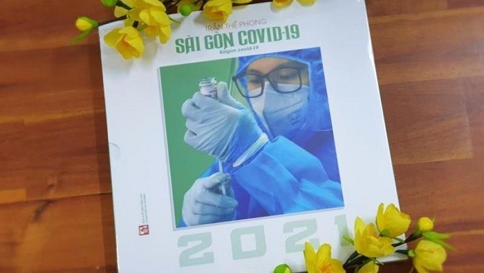 The cover of ‘Sai Gon COVID-19 2021’ photo book (Photo: NDO/Linh Bao)