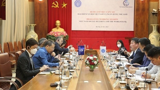 The Vietnam Social Security (VSS) and the World Bank hold a high-level working session in Hanoi on April 21. (Photo: VNA)