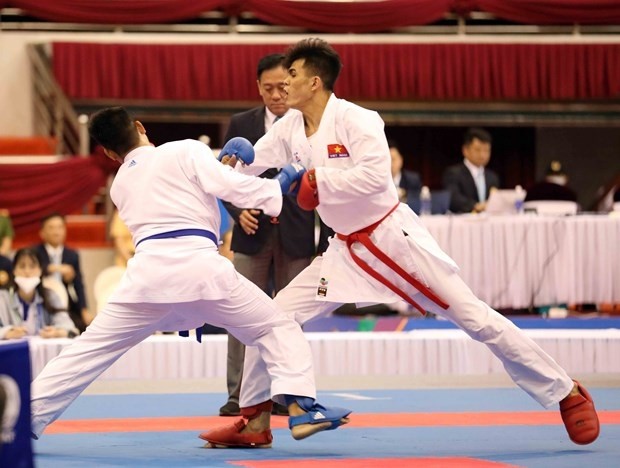 Do Thanh Nhan of Vietnam (red belt) during his match on the day. (Photo: VNA)