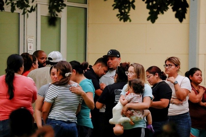 People react outside the Ssgt Willie de Leon Civic Center, where students had been transported from Robb Elementary School after a shooting, in Uvalde, Texas, US May 24, 2022. (Photo: Reuters)