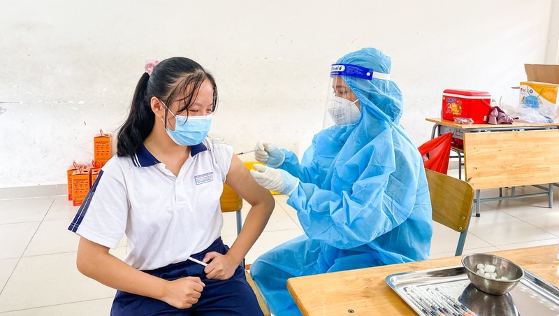 A girl is vaccinated against COVID-19.