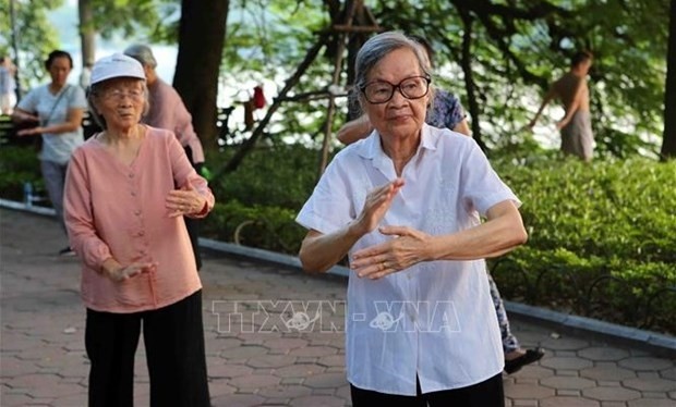 Elderly women doing physical exercise in the Hoan Kiem Lake area in Hanoi’s centre. (Photo: VNA)
