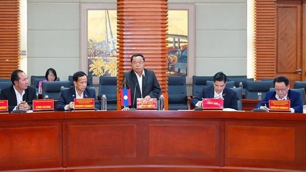 President of the Lao State Inspection Authority Khamphan Phommaphat (standing) addresses the meeting with Hai Phong officials on June 2. (Photo: VNA)