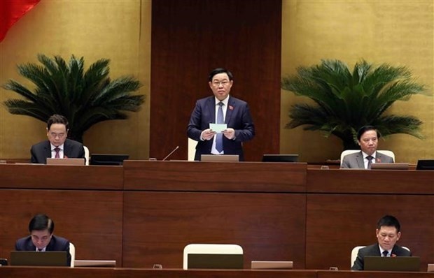 NA Chairman Vuong Dinh Hue speaks after the Finance Minister finishes replying to legislators' questions on June 8. (Photo: VNA)