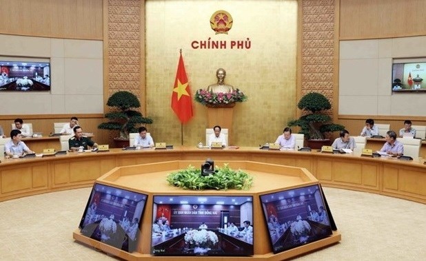 Deputy Prime Minister Le Van Thanh (centre) chairs the meeting on June 14. (Photo: VNA)