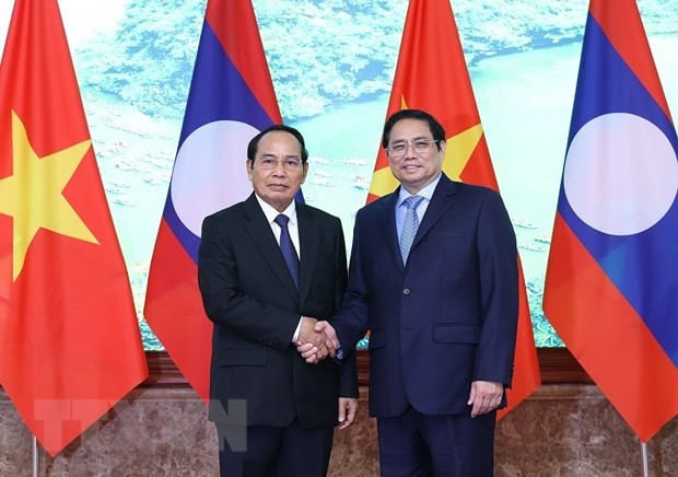 Prime Minister Pham Minh Chinh receives Lao Vice President Bounthong Chitmany in Hanoi on July 18. (Photo: VNA)