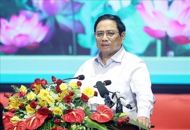 Prime Minister Pham Minh Chinh speaks at the meeting in Ho Chi Minh City on July 27. (Photo: VNA)