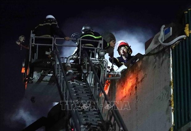 Three firefighters who died while on their duty in Hanoi's Cau Giay district on August 1 afternoon were posthumously promoted to higher rankings. (Photo: cand.com.vn)