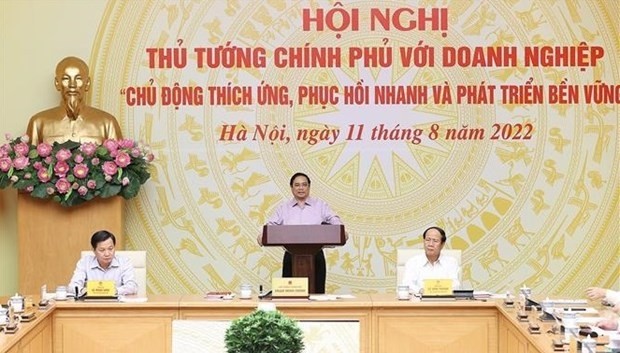 Prime Minister Pham Minh Chinh presides over the Government to Business conference on August 11. (Photo: VNA)
