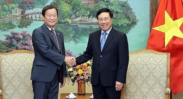 Permanent Deputy Prime Minister Pham Binh Minh (right) and JICA Executive Senior Vice President Junichi Yamada (Photo: VNA)