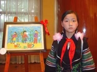 Ly Thi Vang, 11, an ethnic Mong student from Lao Chai high school, and her first prize winning picture.