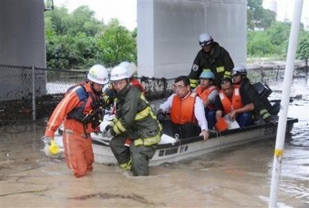Residents are rescued from a flooded area in Nagoya, central Japan, in this photo taken by KyodoSeptember 20, 2011.
