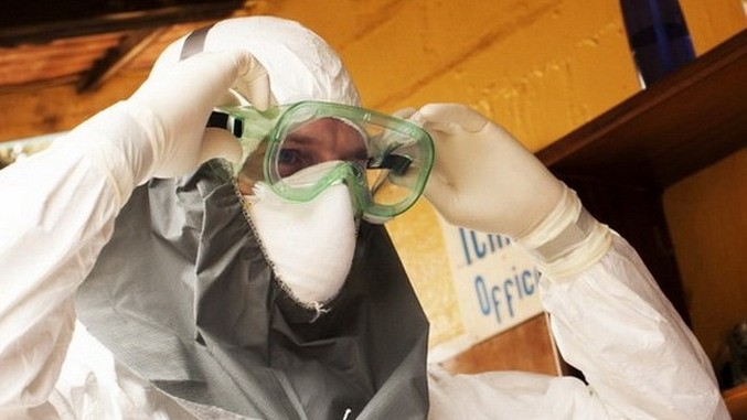 Health workers are carefully equipped to avoid Ebola infection.