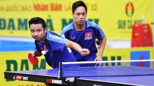The Army team’s Le Tien Dat and Duong Van Nam claim the men’s doubles title following a dramatic final win.  