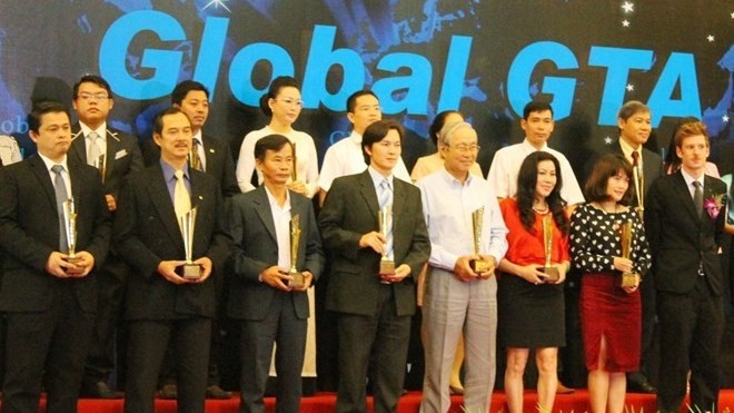 The award recipients at the ceremony (Source: VNA)