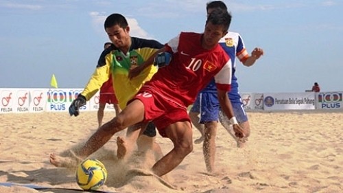 Bui Tran Tuan Anh (in red) scores a hat trick for Vietnam in the final match with hosts Malaysia.