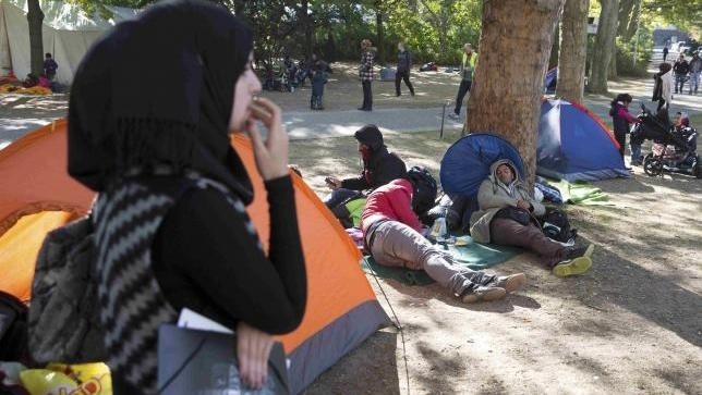 Migrants wait to register at Berlin's central registration centre for refugees and asylum seekers LaGeSo (Landesamt fuer Gesundheit und Soziales) State Office for Health and Social Affairs in Berlin, Germany, October 1, 2015.